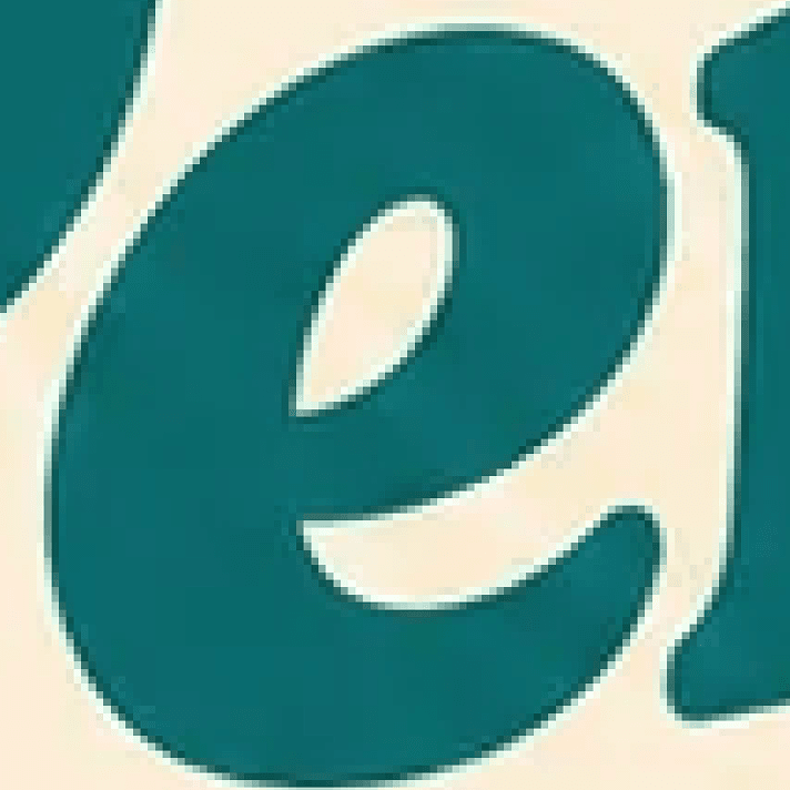 A zoomed-in crop of a logo as a raster image, with soft, blurry, pixelated edges